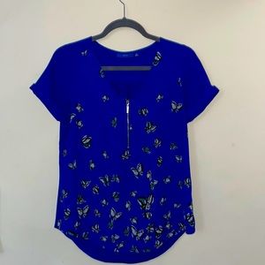 Beautiful and soft flowing blue blouse with butterflies. Size XS.
